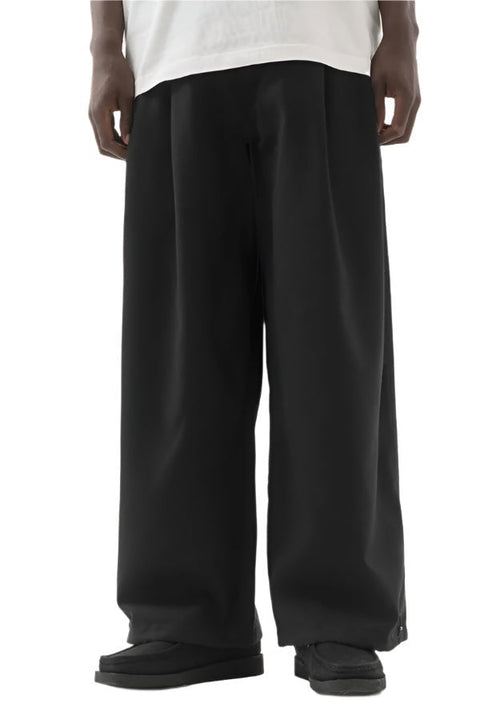 ASYMMETRICAL WOOL PLEATED PANTS - THE ROOM BY BASMATEE